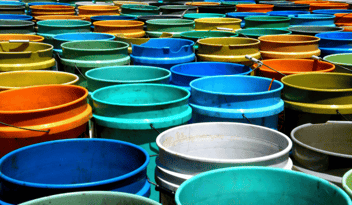 Social Media Content Buckets concept represented by many 5 gallon paint buckets in different colors
