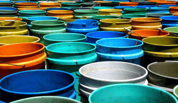 Social Media Content Buckets concept represented by many 5 gallon paint buckets in different colors